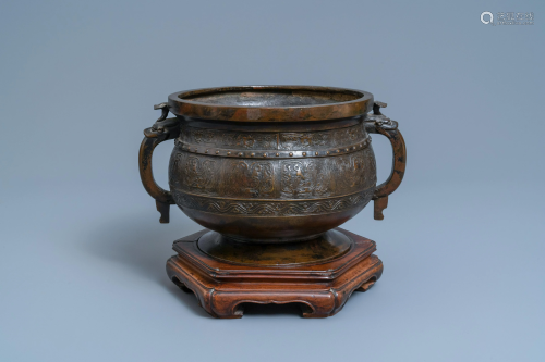A large Chinese bronze 'Gui' vessel on hardwood stand,