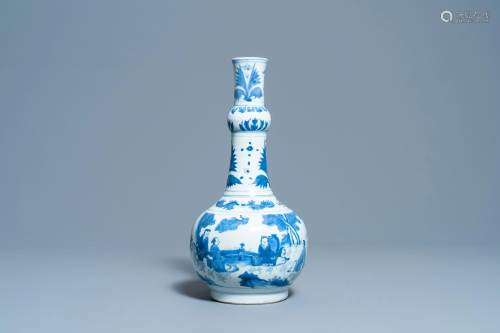 A Chinese blue and white bottle vase with figures in a