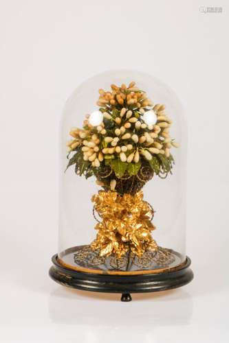 An artificial bouquet of flowers under a glass bell jar, Belgium, 20th century.