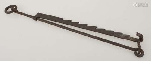 A wrought iron saw-tooth trammel pot hanger for fireplace.