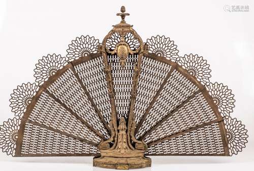 A brass firescreen in the shape of a peacock, France, ca. 1900.