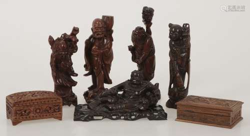 A convolute of (8) pieces Indonesian and Chinese carved wood boxes and figurines.