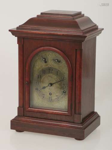 A wooden table clock with several gongs. Keinzle, Germany, 1st half 20th century.