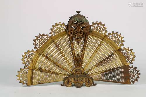 A fan shaped or peacock firescreen, copper, late 19th century.