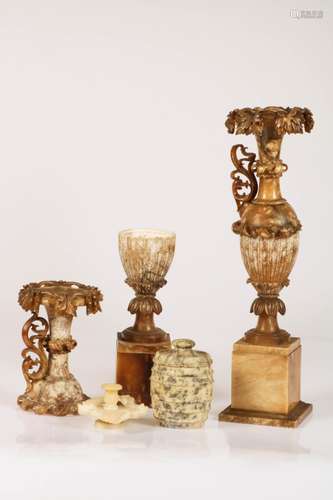 A lot with various alabaster decorative vases, together with a lidded jar.