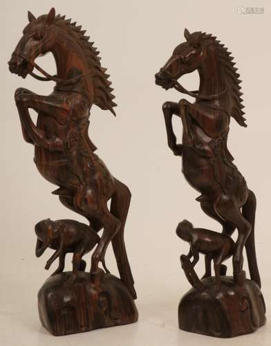 (2) piece set of coromandel/ calamander wood staggering horses with monkeys. Bali, 1920's.