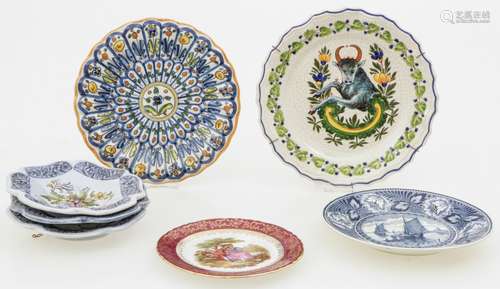 A lot of (7) plates with various decorations.