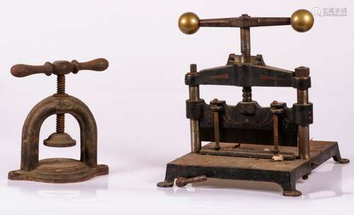 A cartel edge cutter from the graphic industry, together with a industrial press, ca. 1900.