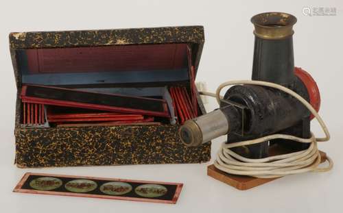 An electrified magic lantern or 'Laterna Magica' and various plates with images in box.