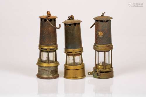 A convolute of (3) miners' lamps, 20th century.