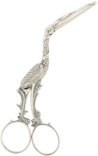 Diaper pliers (also called umbilical pliers) in the shape of a silver stork.