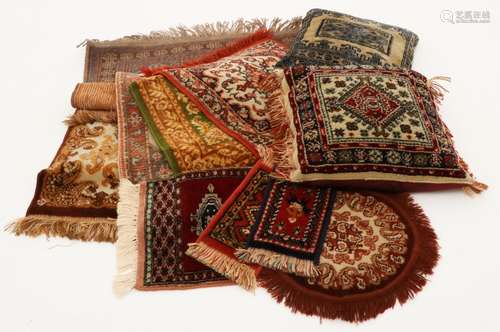 A lot of various Persian cushions and carpets.