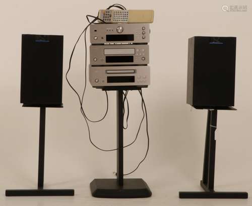 A Lenco stereo tower consisting of a tuner, amplifier and CD player with a set of speakers of the br