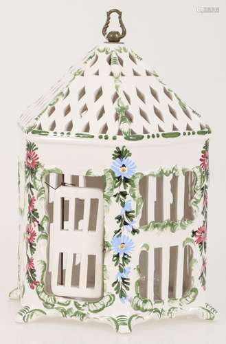 A ceramic birdcage with floral motif. Late 20th century.