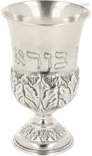 Kiddush cup on a silver base.