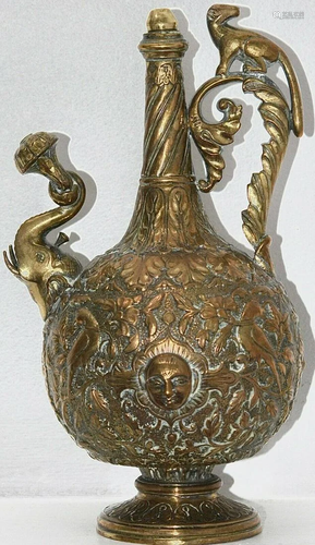 A profusely decorated brass Indian ewer , with floral