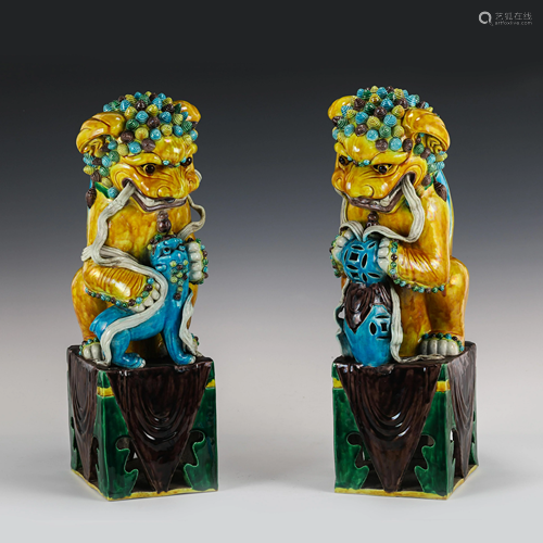 PAIR SANCAI GLAZED PORCELAIN FU LION STATUES