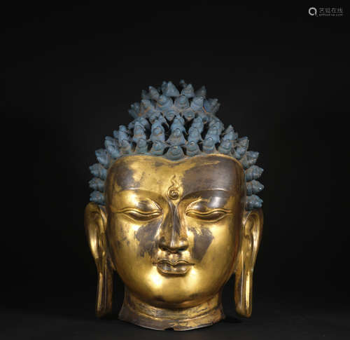 A gilt-bronze buddha head