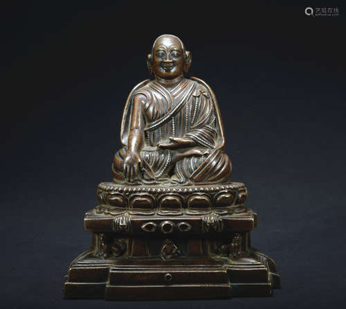 A gilt-bronze statue of Master