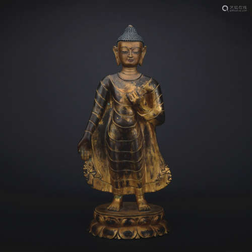 A gilt-bronze statue of Buddha