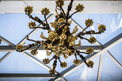 A bronze Louis-Philippe chandelier with wall lighters 'Karyatids' (73x87cm) (35x34cm)