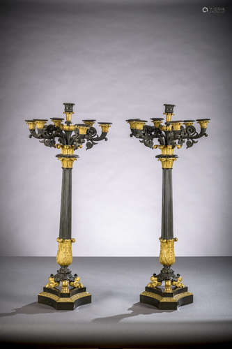 A pair of large Charles X candlesticks in gilt and patinated bronze (h 91 cm)