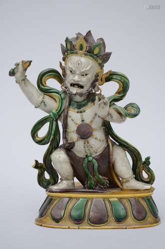 A Chinese buddhist sculpture in biscuit with sancai glaze 'Vajrapani', 18th century (30x21x15