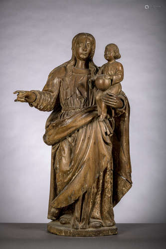 A walnut sculpture 'Standing Virgin and Child' (96 cm) (*)