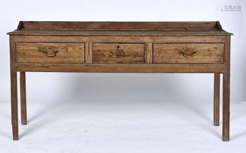 A GEORGE III PINE DRESSER BASE, C1800, WITH SHALLOW THREE QUARTER UPSTAND, THE FRONT WITH MOULDED