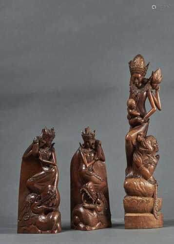 ONE AND A PAIR OF INDONESIAN CARVED WOOD FIGURES, BALI, 20TH C, 60CM H AND SMALLER Condition