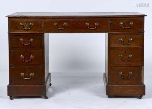 A VICTORIAN MAHOGANY PEDESTAL DESK, C1880, THE RECTANGULAR TOP WITH MOULDED LIP, INSET GILT TOOLED