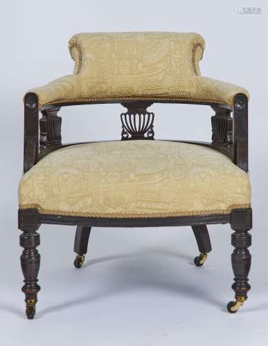 A LATE VICTORIAN MAHOGANY SALON TUB CHAIR WITH OVERSCROLLED UPHOLSTERED BACK ABOVE THREE PIERCED