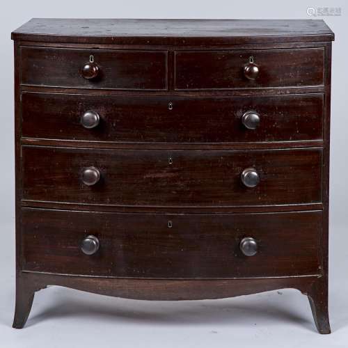 A POST REGENCY MAHOGANY BOW FRONTED CHEST OF TWO SHORT AND THREE LONG GRADUATED, COCKBEADED DRAWERS,