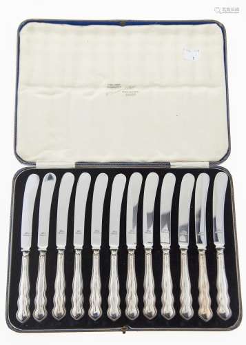 A SET OF TWELVE GEORGE V SILVER HAFTED TEA KNIVES, BY HARRISON FISHER & CO, SHEFFIELD 1931, CASED