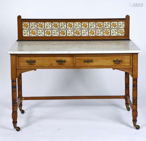 A VICTORIAN OAK WASHSTAND WITH MINTON CHINA WORKS TILED BACK, C1875, THE TILES TRANSFER PRINTED WITH