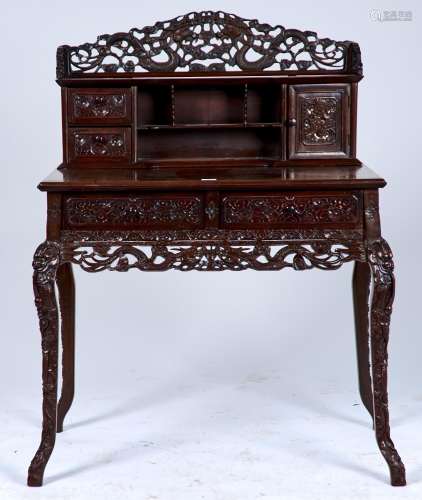 A CHINESE ROSEWOOD WRITING TABLE, c1900, THE SUPERSTRUCTURE CARVED WITH DRAGONS AND FITTED WITH