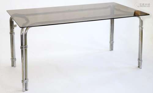 A CHROMIUM PLATED TUBULAR METAL DINING TABLE WITH CINNAMON GLASS TOP, LATE 20TH C, 72CM H; 86 X