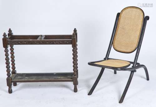 AN EBONISED BENTWOOD FOLDING CHAIR, C1920, ARCHED BACK AND LOZENGE CARVED FRAME, CANED, 90CM H;