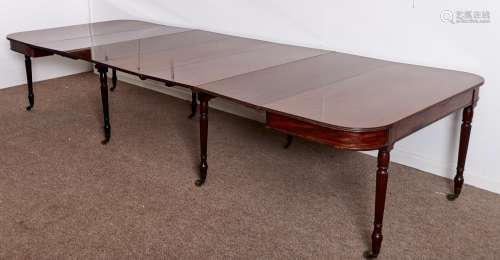 A GEORGE IV MAHOGANY DINING TABLE, C1825, ON FINELY REEDED TAPERING TURNED LEGS WITH BULBOUS FEET