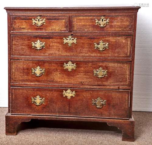A GEORGE III OAK AND CROSSBANDED CHEST OF DRAWERS, LATE 18TH C, THE TOP WITH MOULDED EDGE, SHAPED