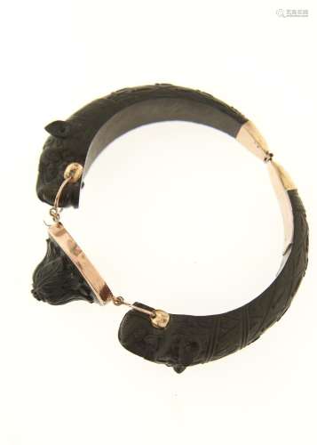 A ZOOMORPHIC CARVED LAVA STONE AND GOLD BRACELET, MID 19TH C, 68 X 79MM OVERALL Condition