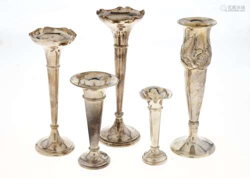 FOUR EDWARDIAN AND LATER SILVER TRUMPET SHAPED VASES AND A CONTINENTAL SILVER FLORAL EMBOSSED