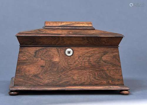 A POST REGENCY ROSEWOOD VENEERED SARCOPHAGUS SHAPED TEA CADDY, C1830, THE TOP WITH DOMED PANEL,