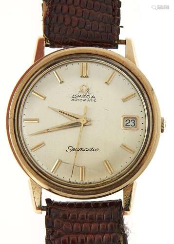AN OMEGA 9CT GOLD SELF WINDING GENTLEMAN'S WRISTWATCH, SEAMASTER, WITH DATE, ON A LEATHER STRAP WITH