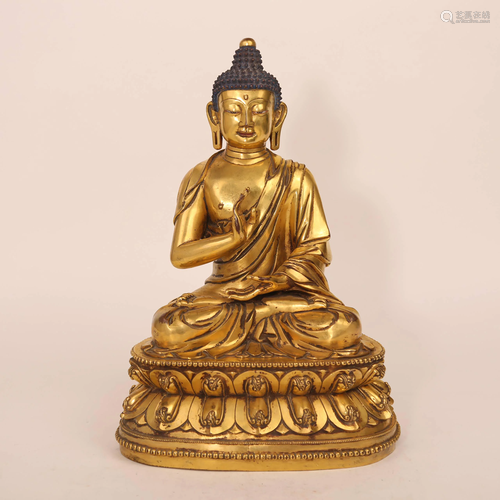 A gilded bronze statue of a fifteenth-century Buddha