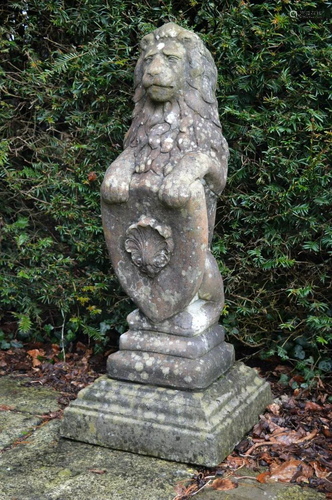 PAIR OF MOULDED STONE ARMORIAL LIONS