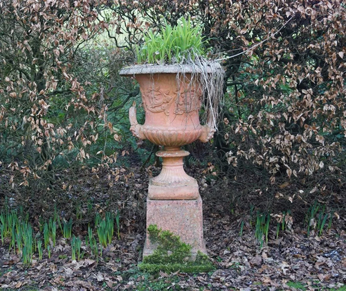 PAIR OF TERRACOTTA URNS ON STAND