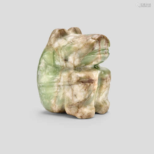 An olive-green, beige and russet Jade Figure of a crouching Bear Shang Dynasty (circa. 1600-1100 BCE)