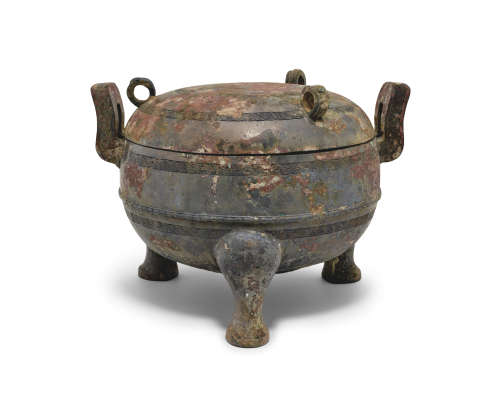 An archaic bronze tripod vessel and domed cover, Ding Eastern Zhou Dynasty (770-256 BC)