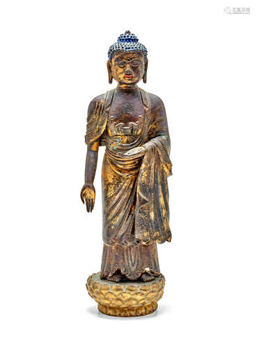 A REPOUSSE BRONZE FIGURE OF BUDDHA Qianlong period